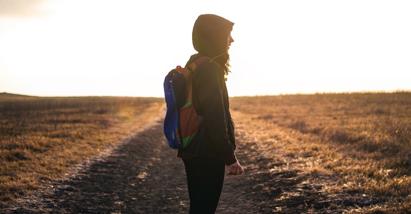 girl on path at sunset