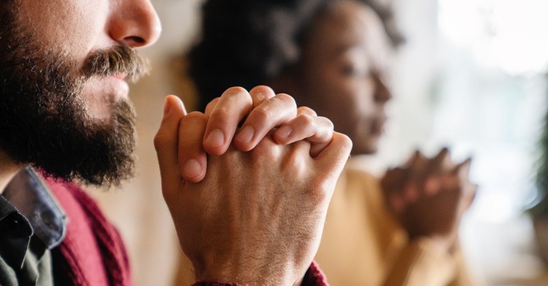 Two people praying