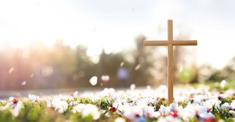 Cross amongst flower petals