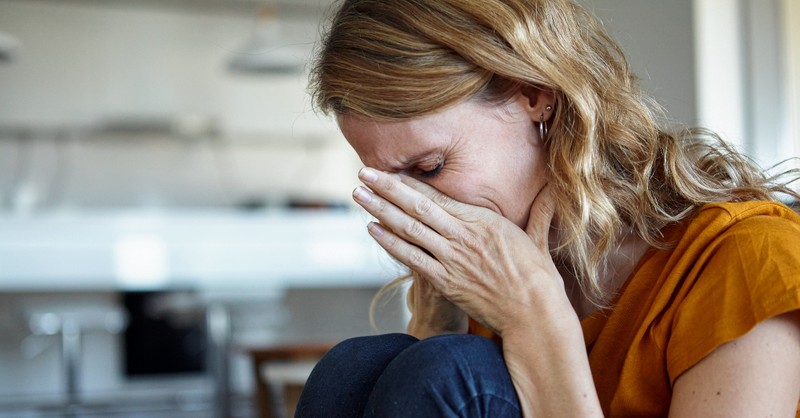 Woman crying and praying