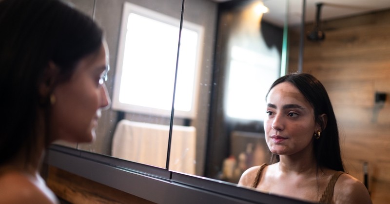 Woman looking in the mirror