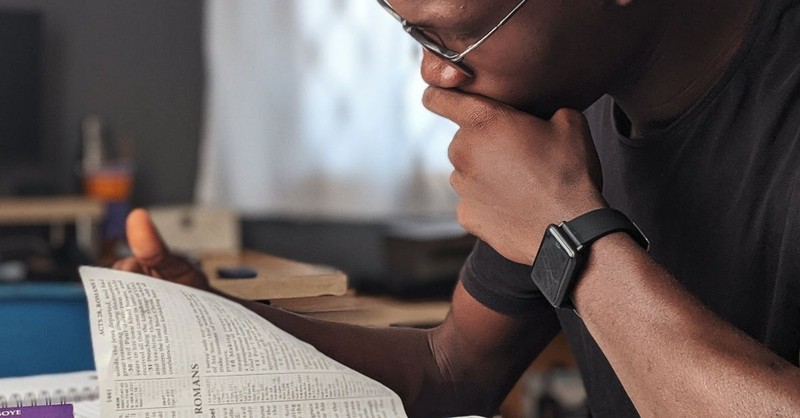 Man reading the Bible for wisdom.