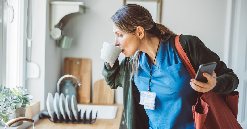 Nurse medical doctor getting ready for work drinking coffee job