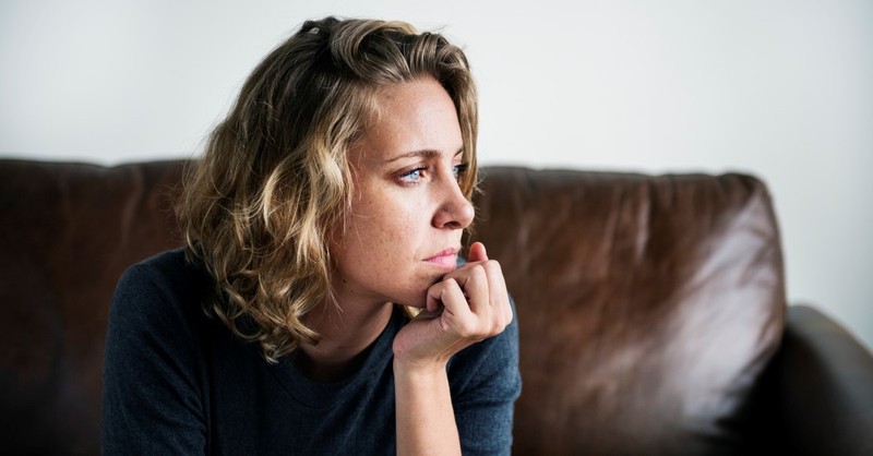 woman looking worried and sad, how to spot false prophets