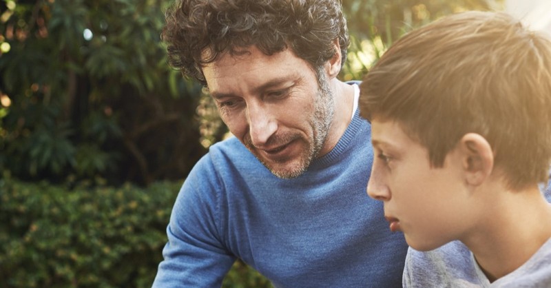 father talking to son