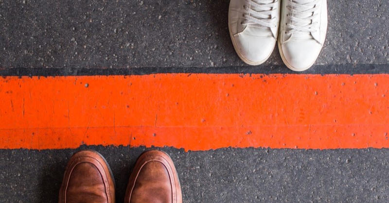 shoes on different sides of a line to demonstrate healthy parent child boundaries